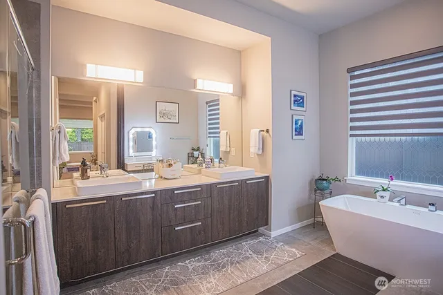 a living room with furniture a flat screen tv and a window