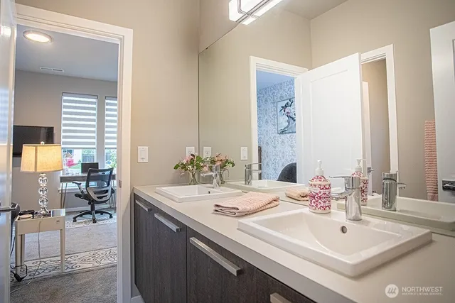 a bathroom with a toilet and a shower curtain