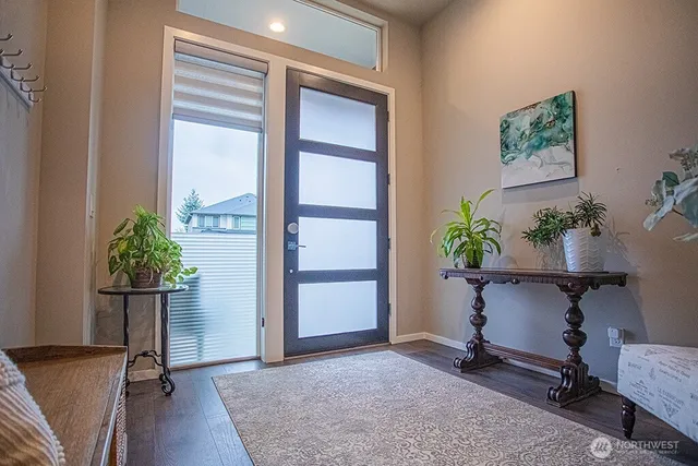 a view of room with furniture and a potted plant