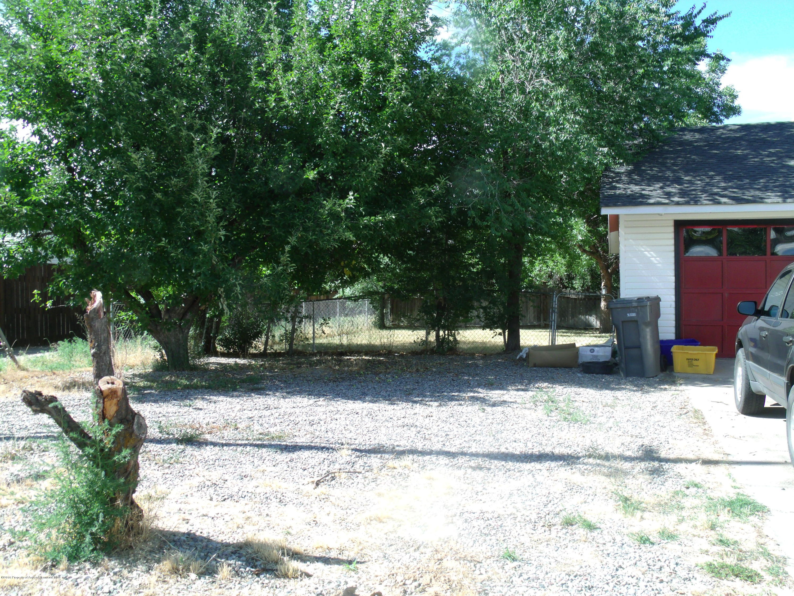1202 West 5th Street Rifle, CO 81650 - Photo 12 of 14 a view of a house with a yard