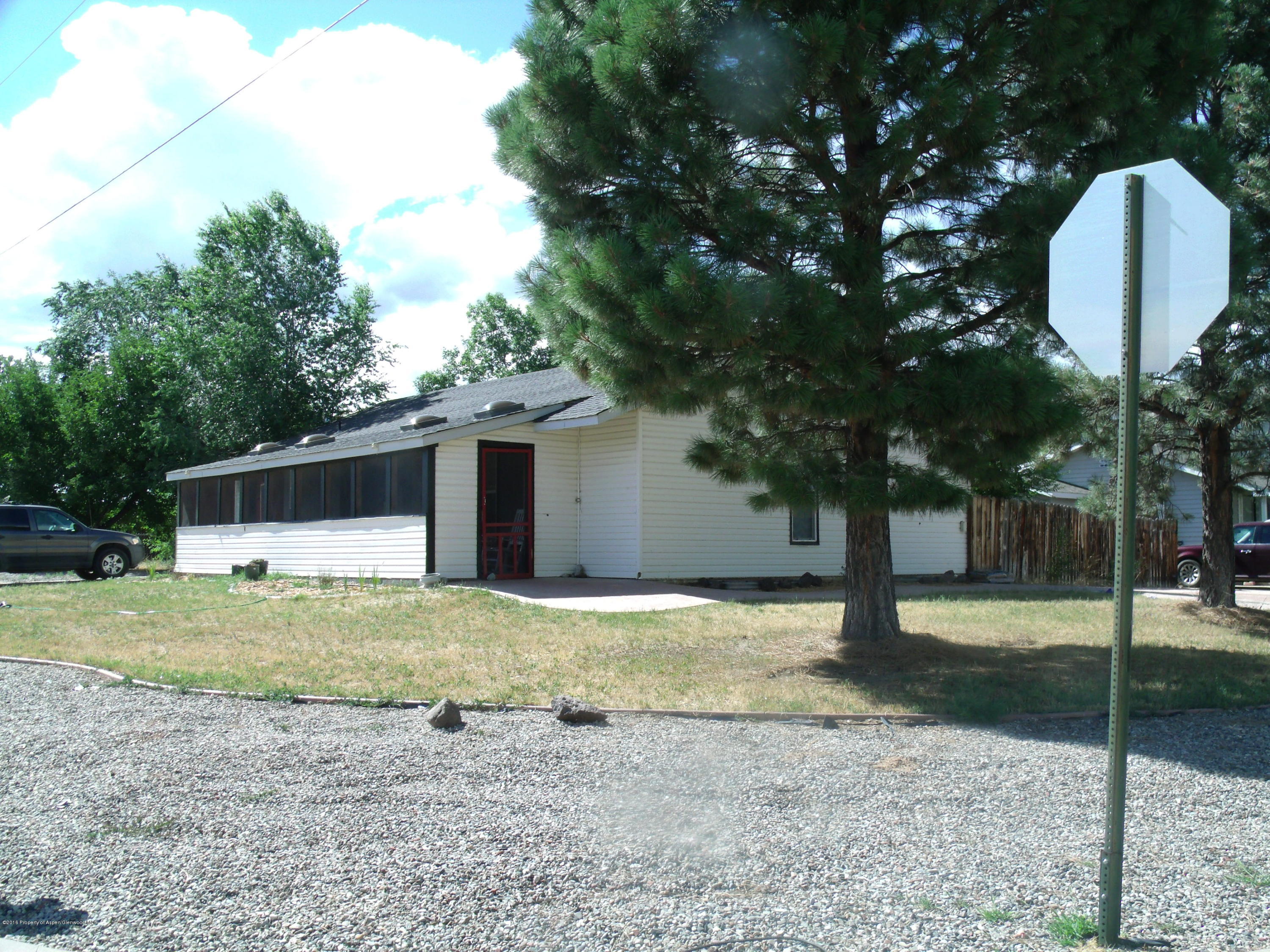 1202 West 5th Street Rifle, CO 81650 - Photo 2 of 14 a house with trees in front of it