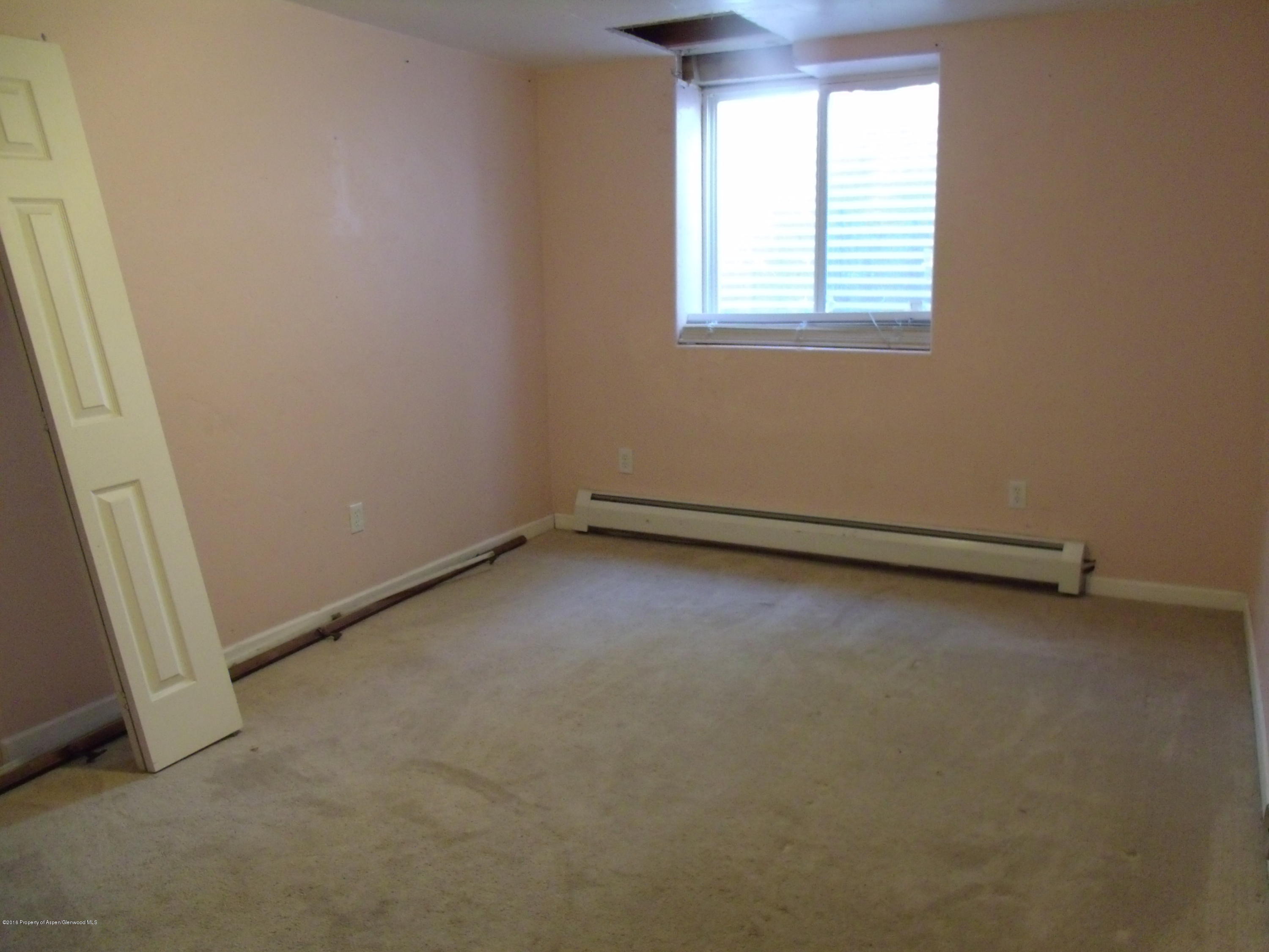 1202 West 5th Street Rifle, CO 81650 - Photo 9 of 14 an empty room with a window