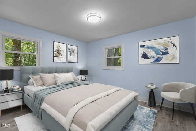 a bedroom with a bed and a couch