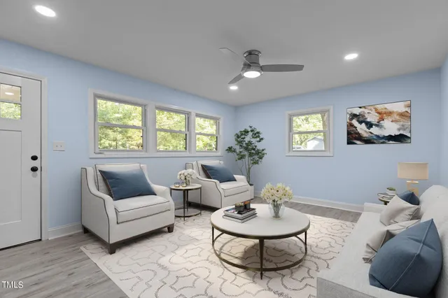 a living room with furniture and a large window