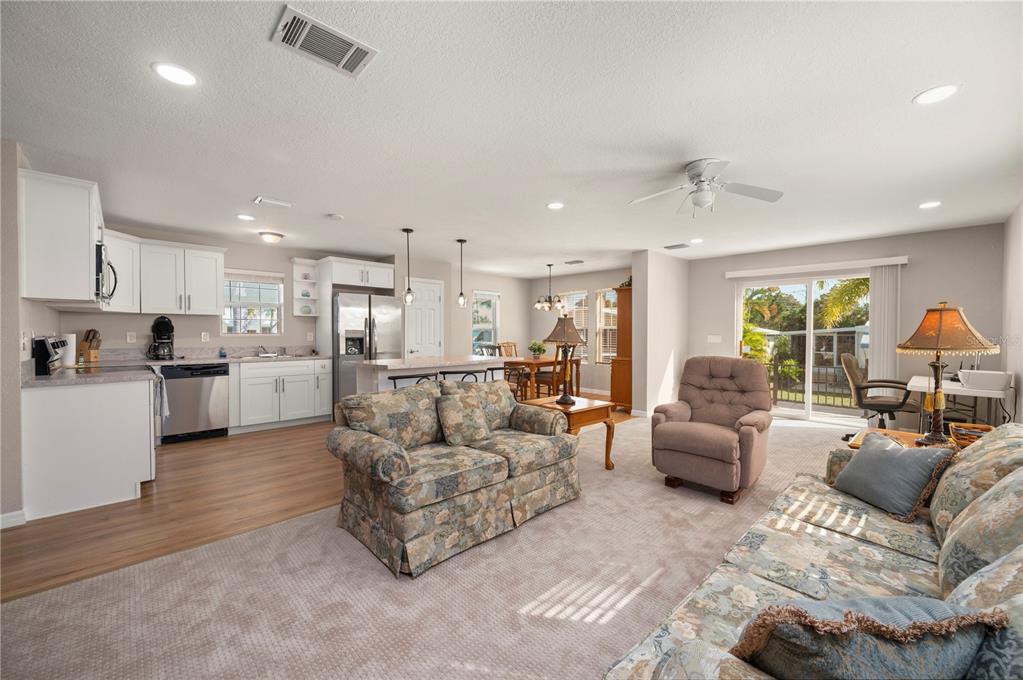 24437 Harbor View Road, Unit 51 Punta Gorda, FL 33980 - Photo 12 of 61 a living room with furniture and kitchen view