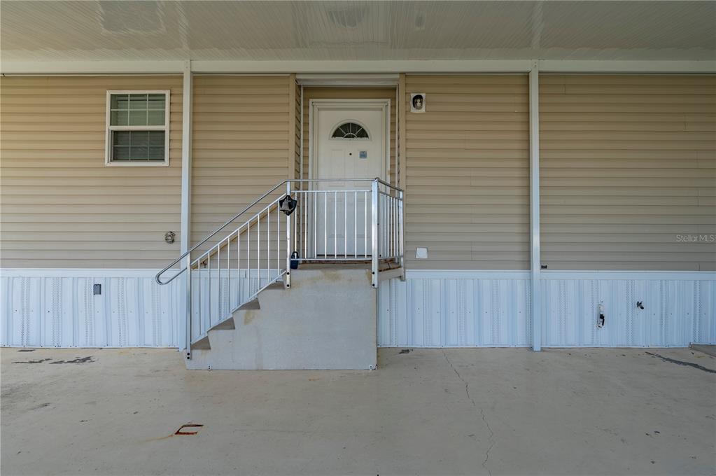 24437 Harbor View Road, Unit 51 Punta Gorda, FL 33980 - Photo 16 of 61 a view of a house with wooden stairs