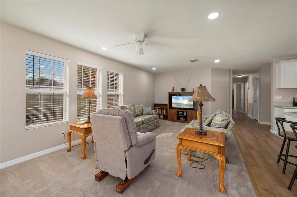 24437 Harbor View Road, Unit 51 Punta Gorda, FL 33980 - Photo 19 of 61 a living room with furniture and a window