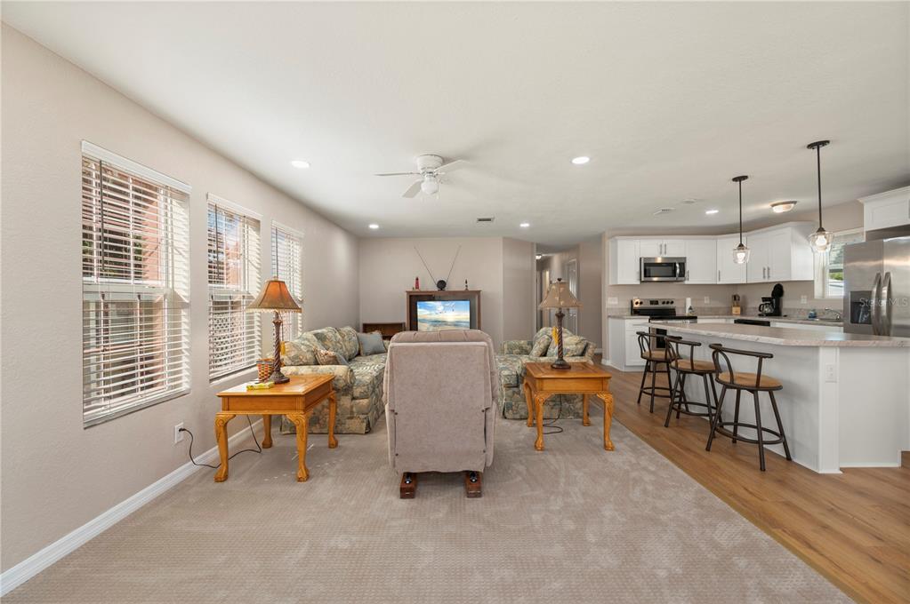 24437 Harbor View Road, Unit 51 Punta Gorda, FL 33980 - Photo 20 of 61 a living room with furniture and a table