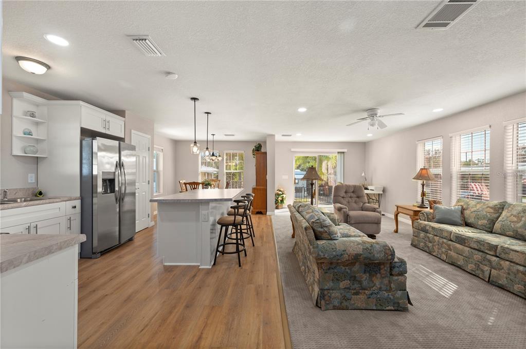 24437 Harbor View Road, Unit 51 Punta Gorda, FL 33980 - Photo 2 of 61 a living room with furniture and a large window