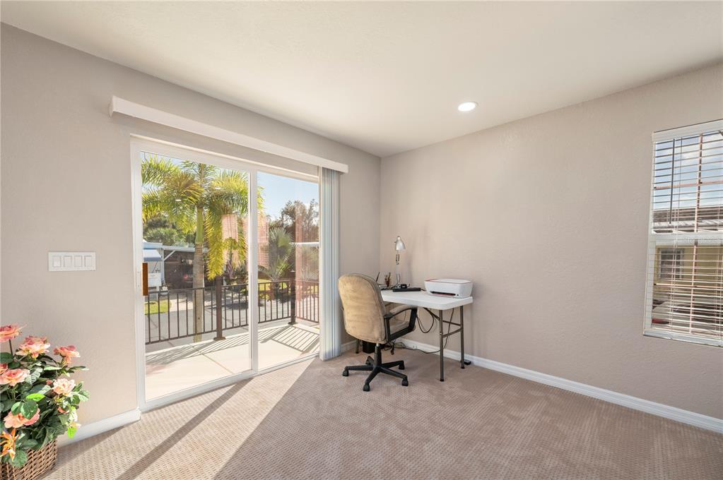 24437 Harbor View Road, Unit 51 Punta Gorda, FL 33980 - Photo 21 of 61 a workspace with wooden floor and a window