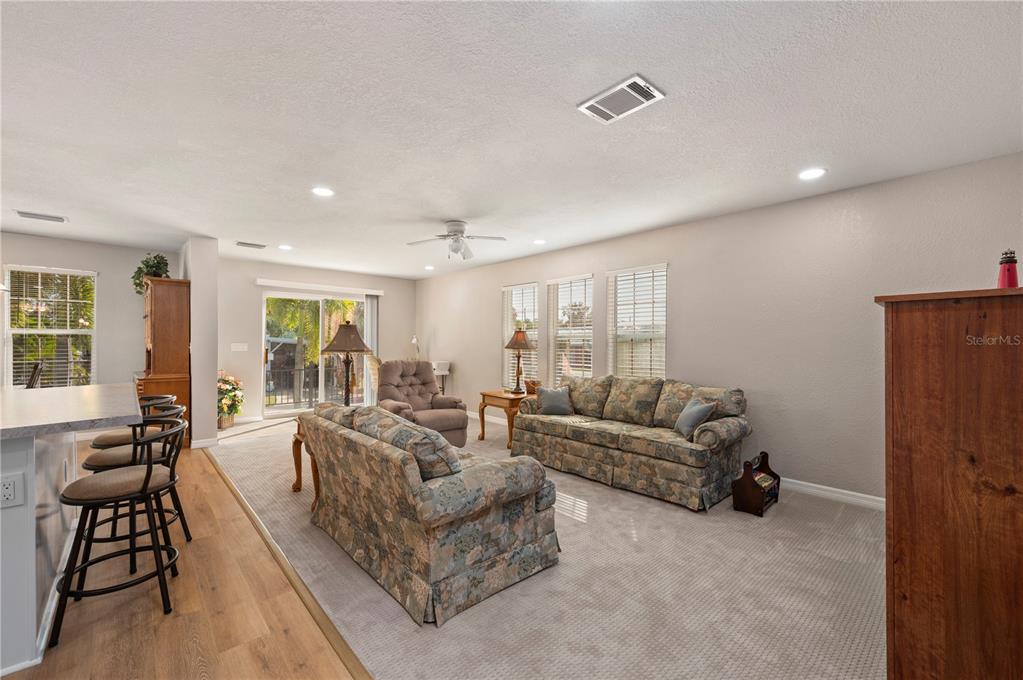 24437 Harbor View Road, Unit 51 Punta Gorda, FL 33980 - Photo 3 of 61 a living room with furniture and a large window