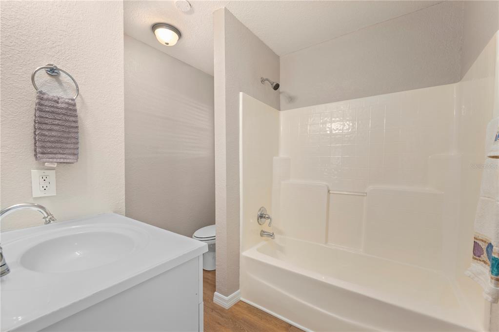 24437 Harbor View Road, Unit 51 Punta Gorda, FL 33980 - Photo 33 of 61 a bathroom with a sink a toilet and shower