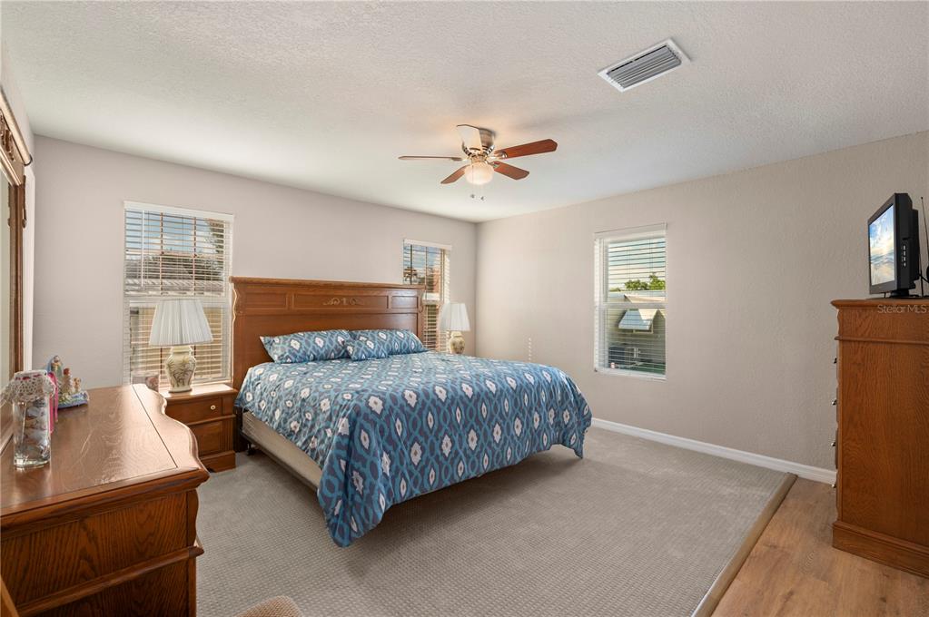 24437 Harbor View Road, Unit 51 Punta Gorda, FL 33980 - Photo 4 of 61 a bedroom with a bed dresser and a window