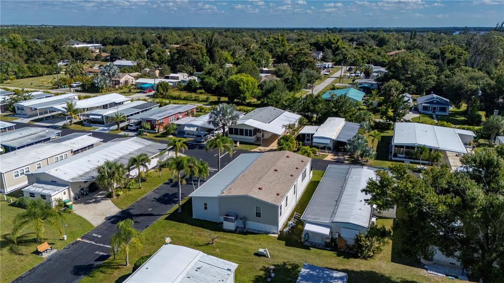 24437 Harbor View Road, Unit 51 Punta Gorda, FL 33980 - Photo 48 of 61 an aerial view of a houses with a yard