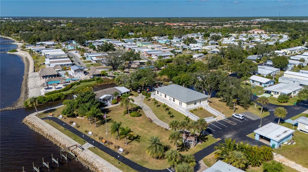 24437 Harbor View Road, Unit 51 Punta Gorda, FL 33980 - Photo 52 of 61 an aerial view of residential houses with outdoor space
