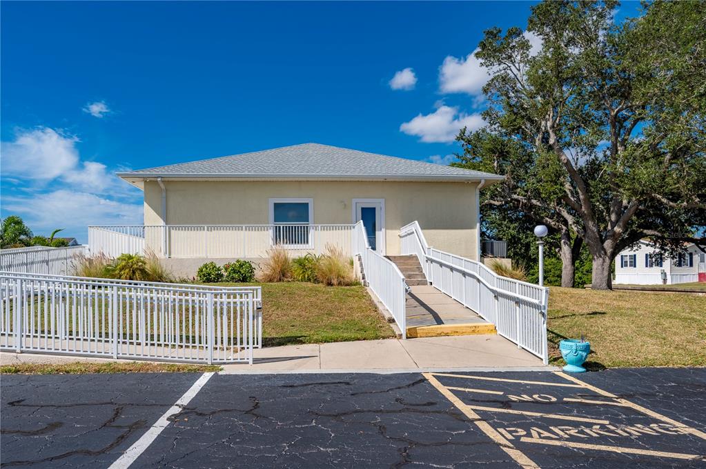 24437 Harbor View Road, Unit 51 Punta Gorda, FL 33980 - Photo 55 of 61 a front view of a house with a yard