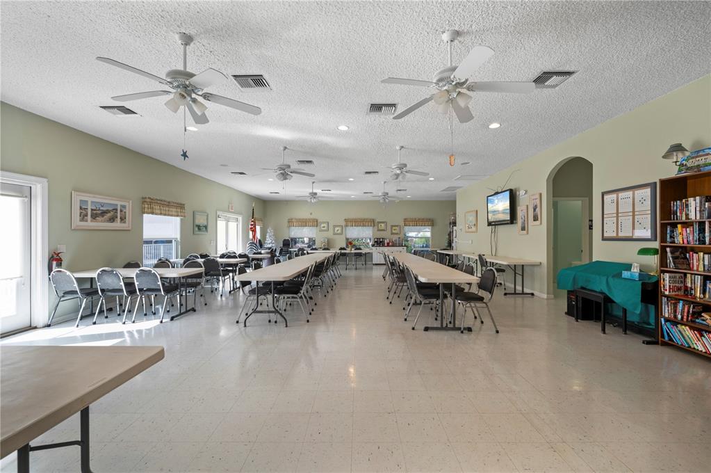 24437 Harbor View Road, Unit 51 Punta Gorda, FL 33980 - Photo 57 of 61 a view of a livingroom with furniture and a table