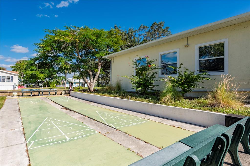 24437 Harbor View Road, Unit 51 Punta Gorda, FL 33980 - Photo 59 of 61 a swimming pool with outdoor seating and yard