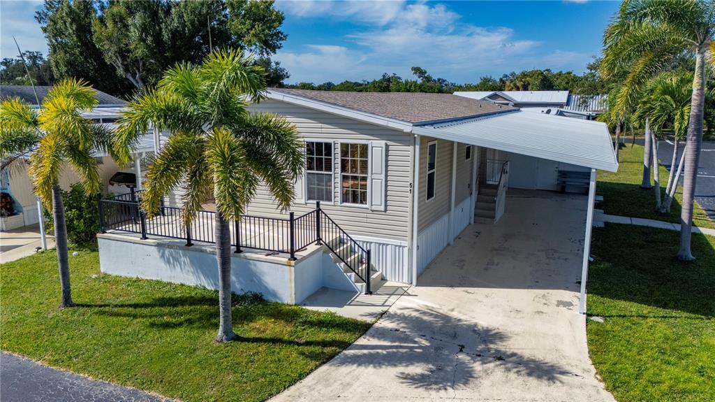 24437 Harbor View Road, Unit 51 Punta Gorda, FL 33980 - Photo 6 of 61 a front view of a house with garden