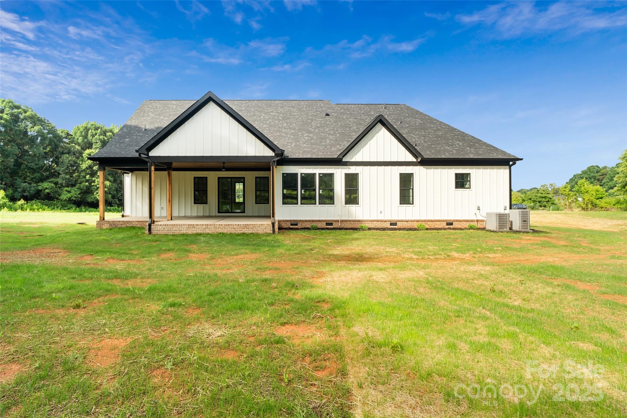 5015 Lancaster Highway Monroe, NC 28112 - Photo 14 of 46 a front view of a house with yard and green space