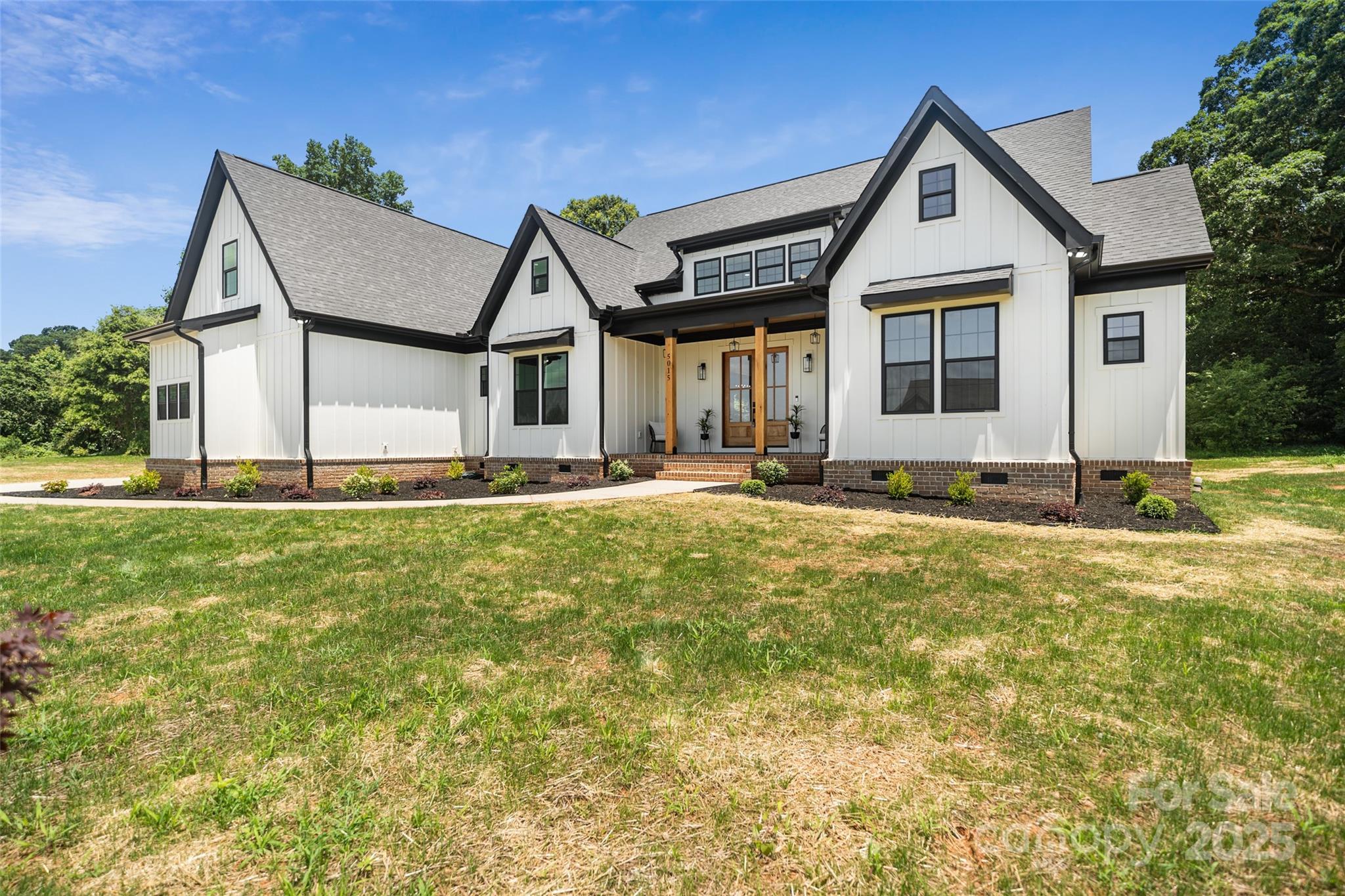 5015 Lancaster Highway Monroe, NC 28112 - Photo 19 of 46 a front view of a house with a yard