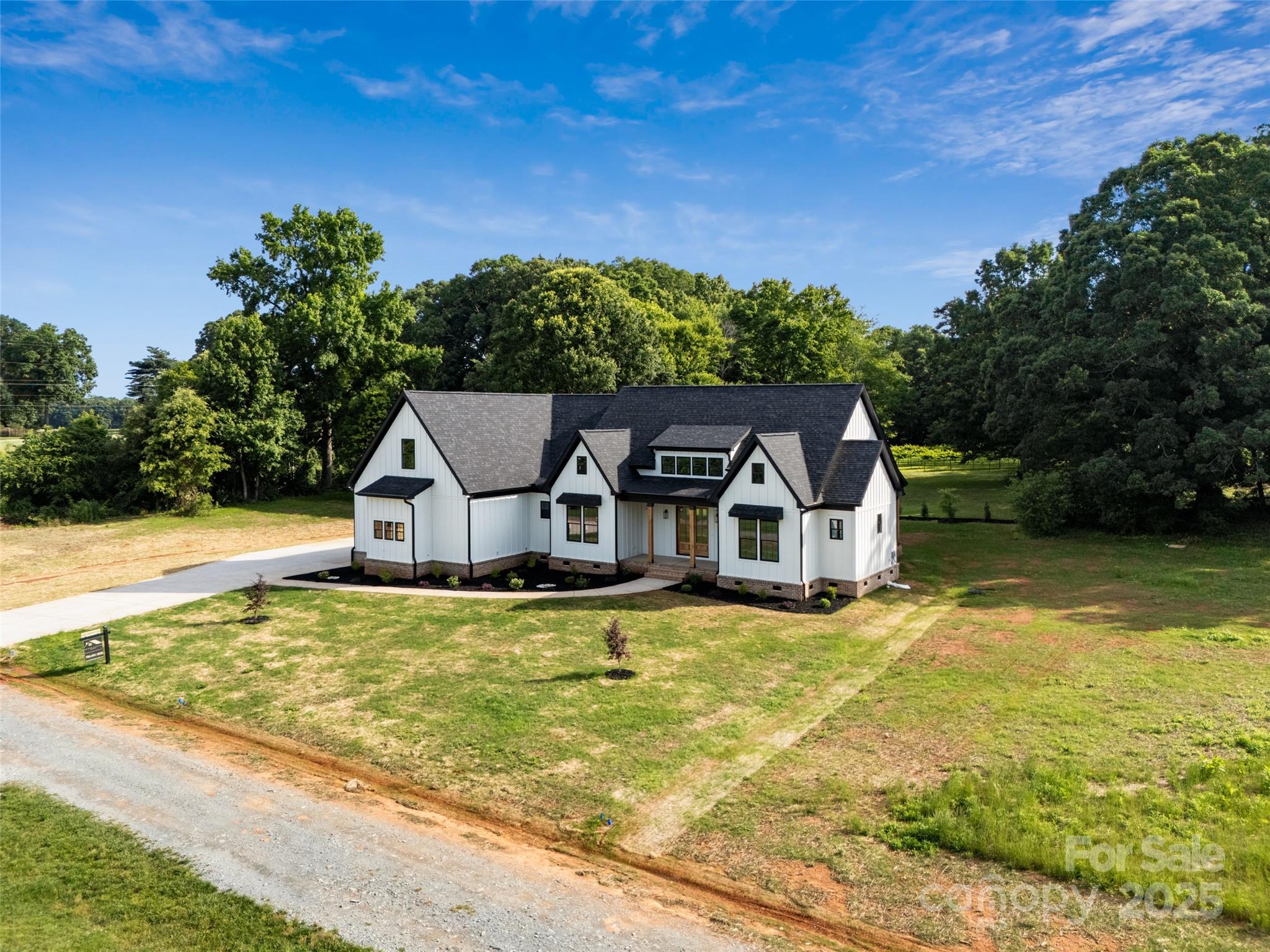 5015 Lancaster Highway Monroe, NC 28112 - Photo 2 of 46 a front view of a house with a yard