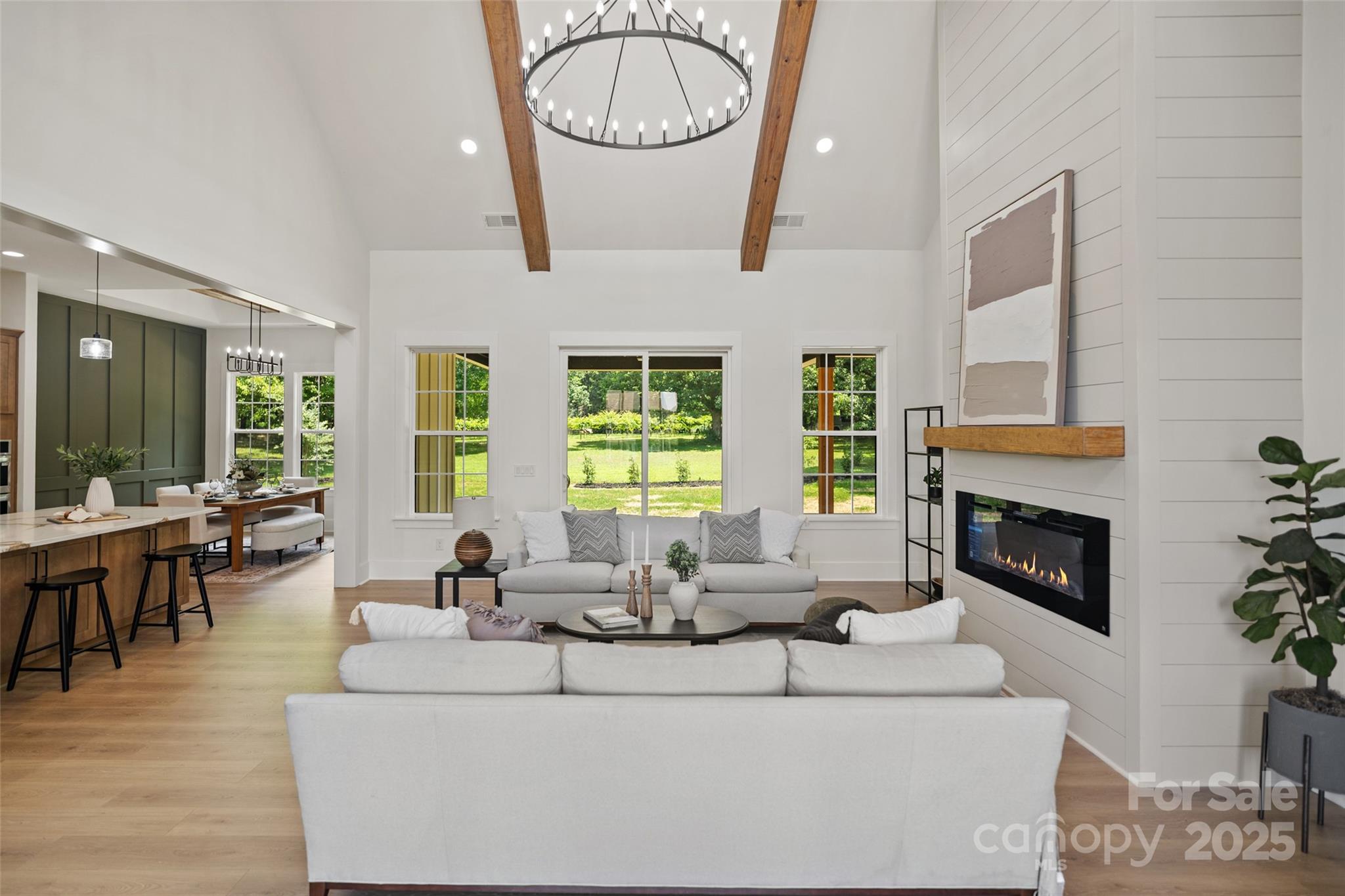5015 Lancaster Highway Monroe, NC 28112 - Photo 28 of 46 a living room with furniture a fireplace and a large window