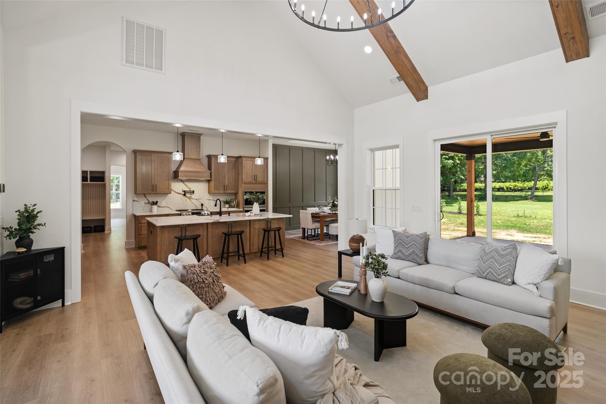 5015 Lancaster Highway Monroe, NC 28112 - Photo 29 of 46 a living room with furniture a rug kitchen view and a window