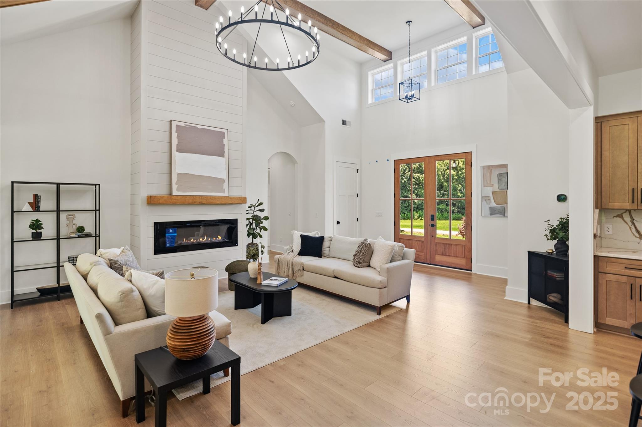 5015 Lancaster Highway Monroe, NC 28112 - Photo 30 of 46 a living room with furniture a fireplace and a chandelier