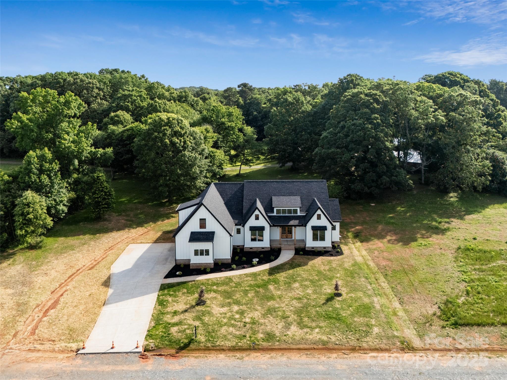 5015 Lancaster Highway Monroe, NC 28112 - Photo 3 of 46 an aerial view of a house with a yard