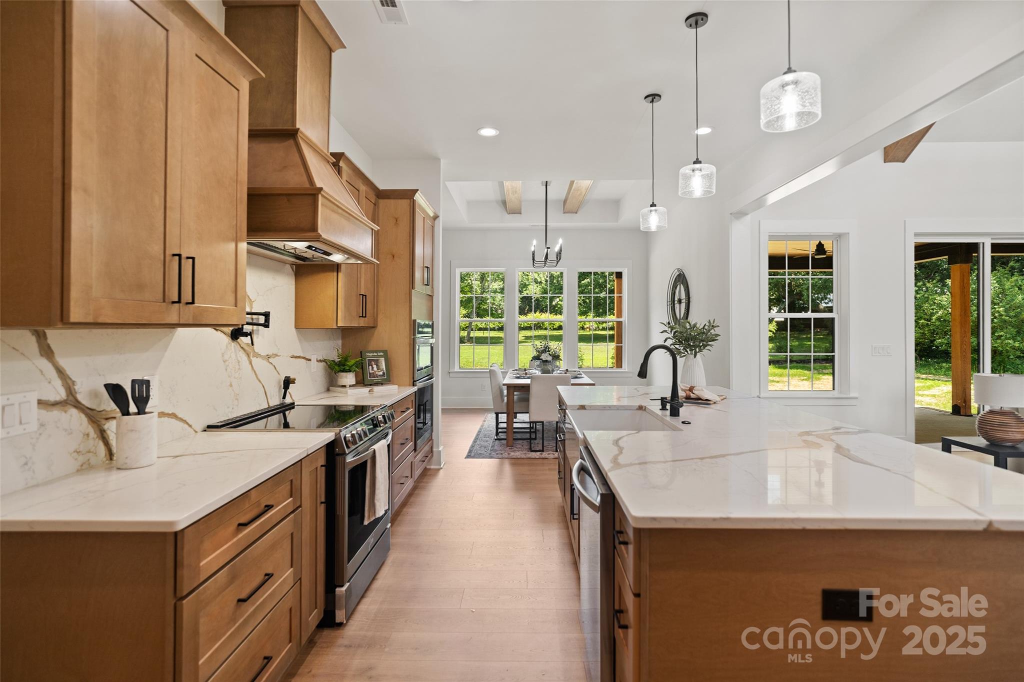5015 Lancaster Highway Monroe, NC 28112 - Photo 34 of 46 a kitchen with stainless steel appliances granite countertop a sink a stove and a refrigerator