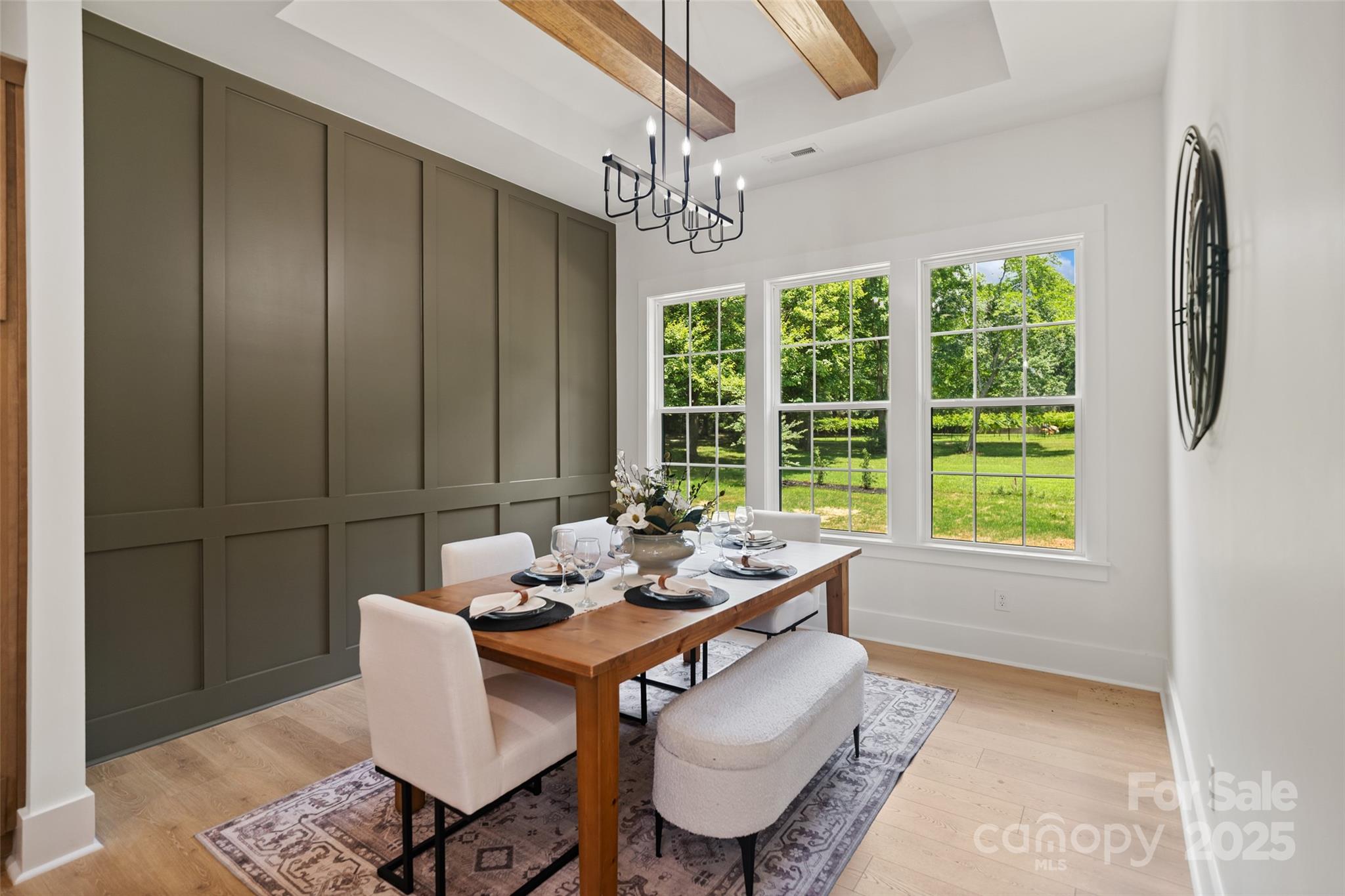 5015 Lancaster Highway Monroe, NC 28112 - Photo 36 of 46 a dining room with furniture a rug and a chandelier