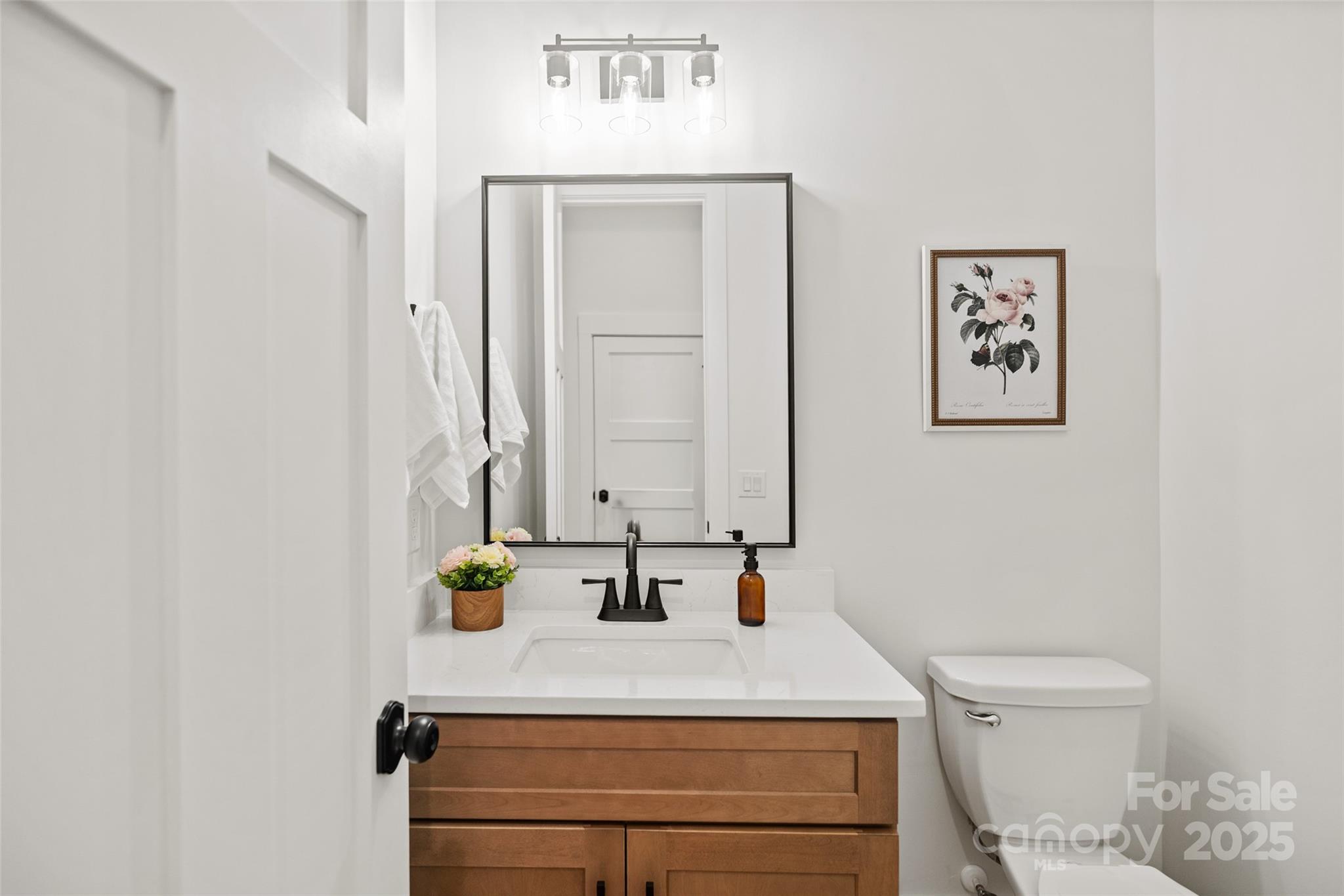5015 Lancaster Highway Monroe, NC 28112 - Photo 40 of 46 a bathroom with a sink a toilet and mirror