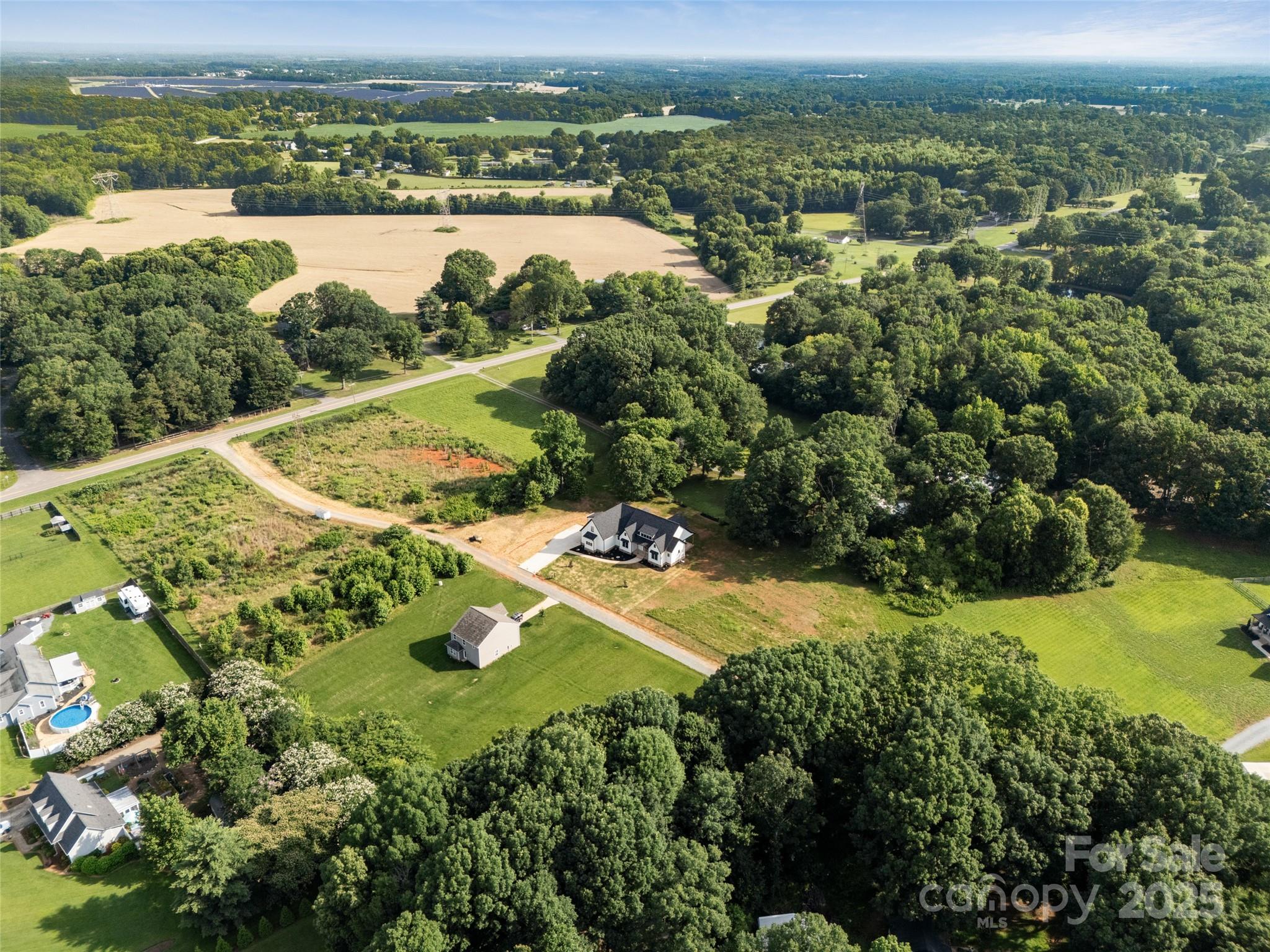 5015 Lancaster Highway Monroe, NC 28112 - Photo 4 of 46 an aerial view of residential houses with outdoor space and city view
