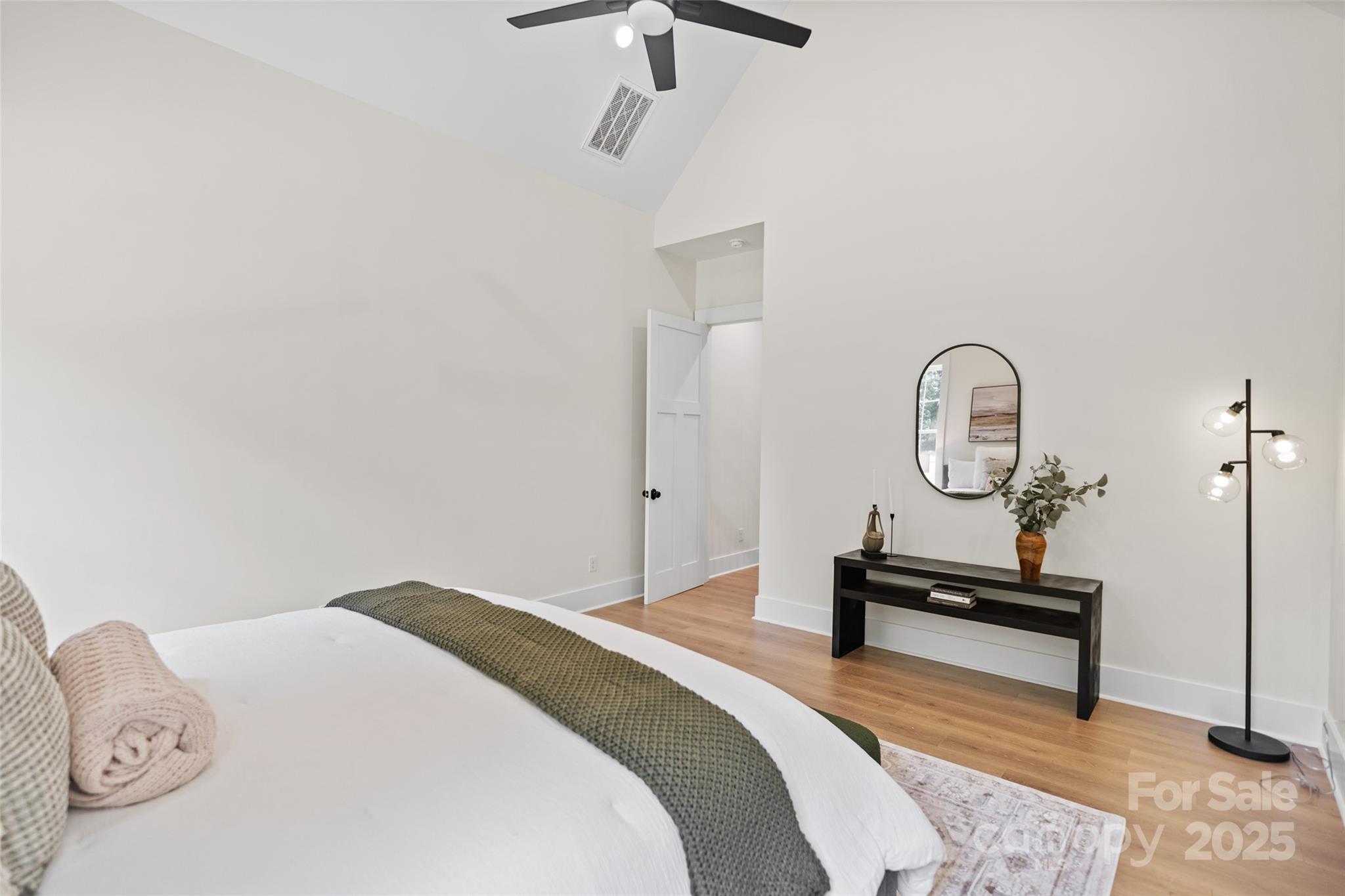 5015 Lancaster Highway Monroe, NC 28112 - Photo 43 of 46 a bedroom with bed and a chandelier