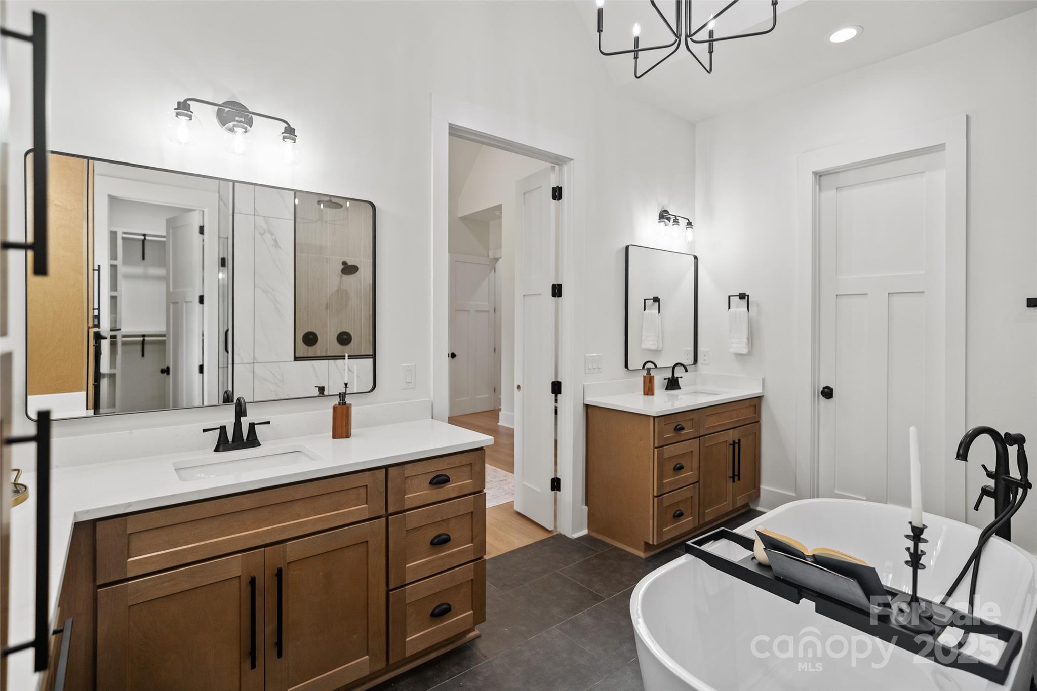 5015 Lancaster Highway Monroe, NC 28112 - Photo 46 of 46 a spacious bathroom with a double vanity sink a mirror a bathtub and a shower