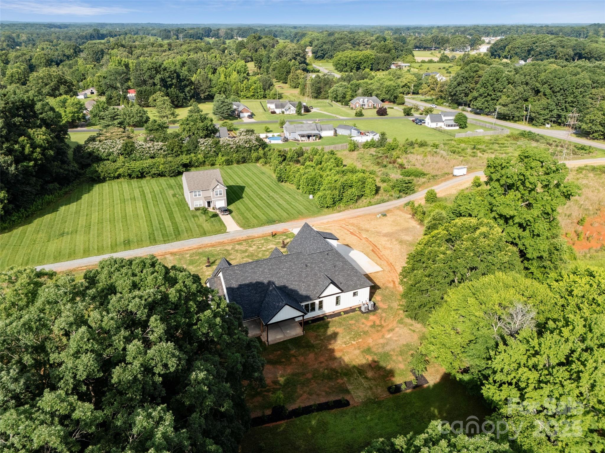 5015 Lancaster Highway Monroe, NC 28112 - Photo 5 of 46 a view of a garden with a houses