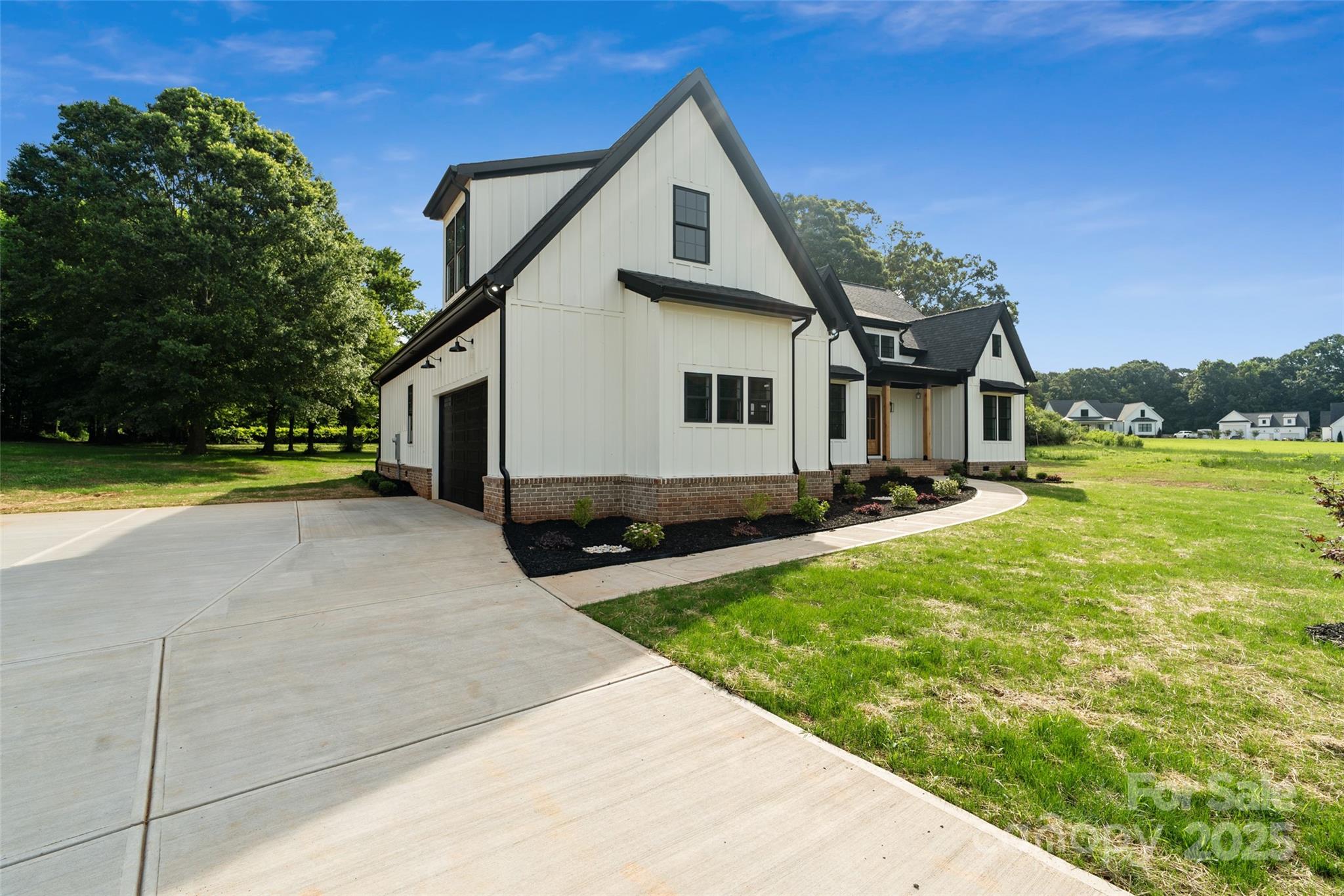 5015 Lancaster Highway Monroe, NC 28112 - Photo 6 of 46 a front view of a house with a yard