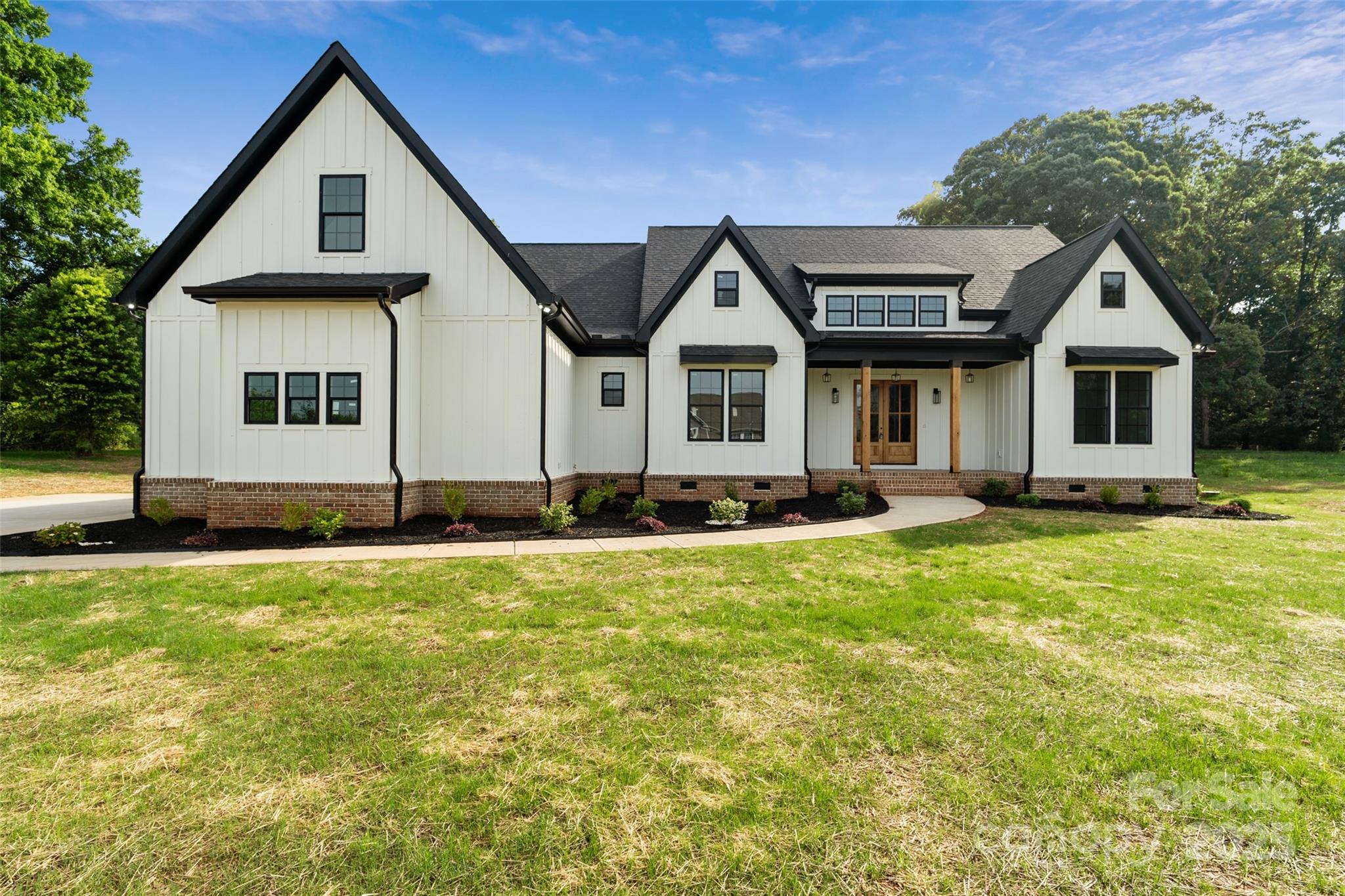 5015 Lancaster Highway Monroe, NC 28112 - Photo 8 of 46 a front view of a house with a yard