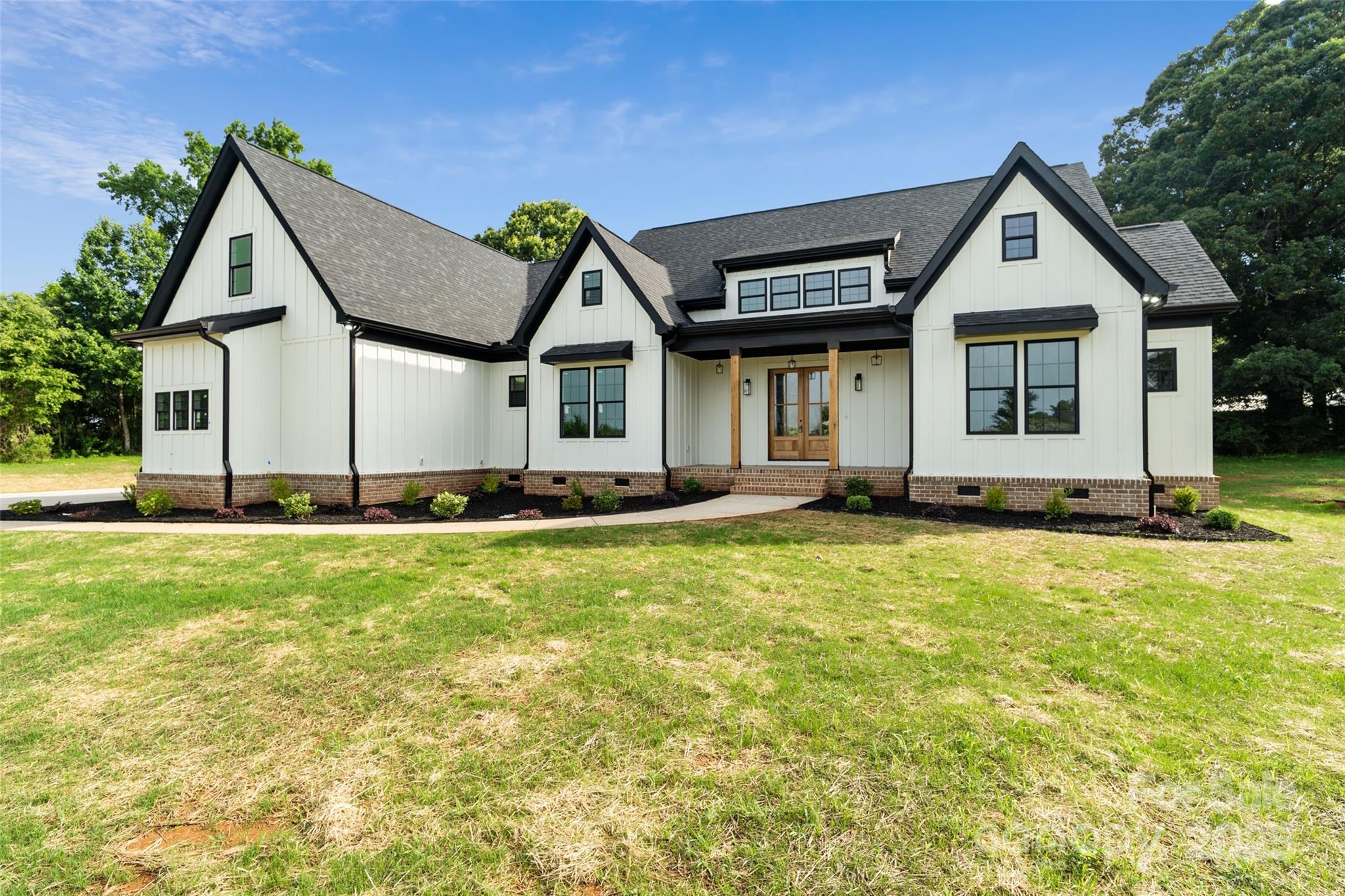 5015 Lancaster Highway Monroe, NC 28112 - Photo 9 of 46 a front view of a house with a yard
