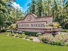 3385 Wooded Lane Conroe, TX 77301 - Photo 2 of 6 a sign broad in front of the red brick house