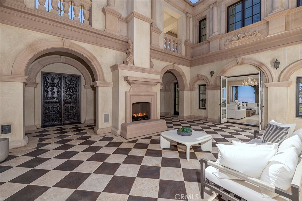 26 Deep Sea Newport Coast, CA 92657 - Photo 12 of 50 a view of a livingroom with a fireplace a rug a fireplace and windows