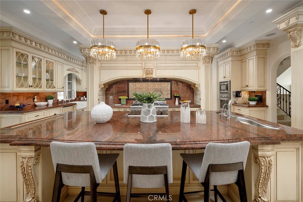 26 Deep Sea Newport Coast, CA 92657 - Photo 15 of 50 a view of a dining room with furniture a chandelier and wooden floor