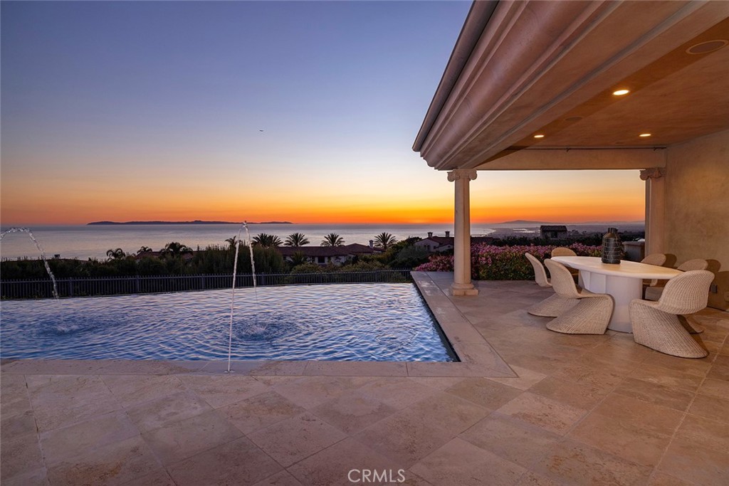 26 Deep Sea Newport Coast, CA 92657 - Photo 20 of 50 a view of a swimming pool with a lounge chair