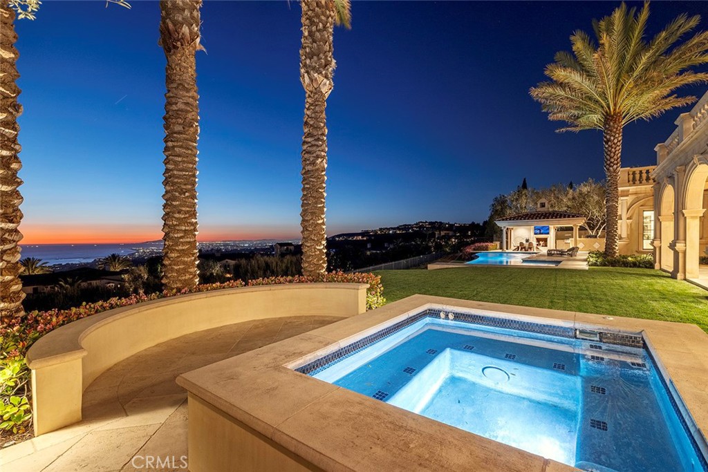 26 Deep Sea Newport Coast, CA 92657 - Photo 23 of 50 a view of a swimming pool with a yard and sitting area