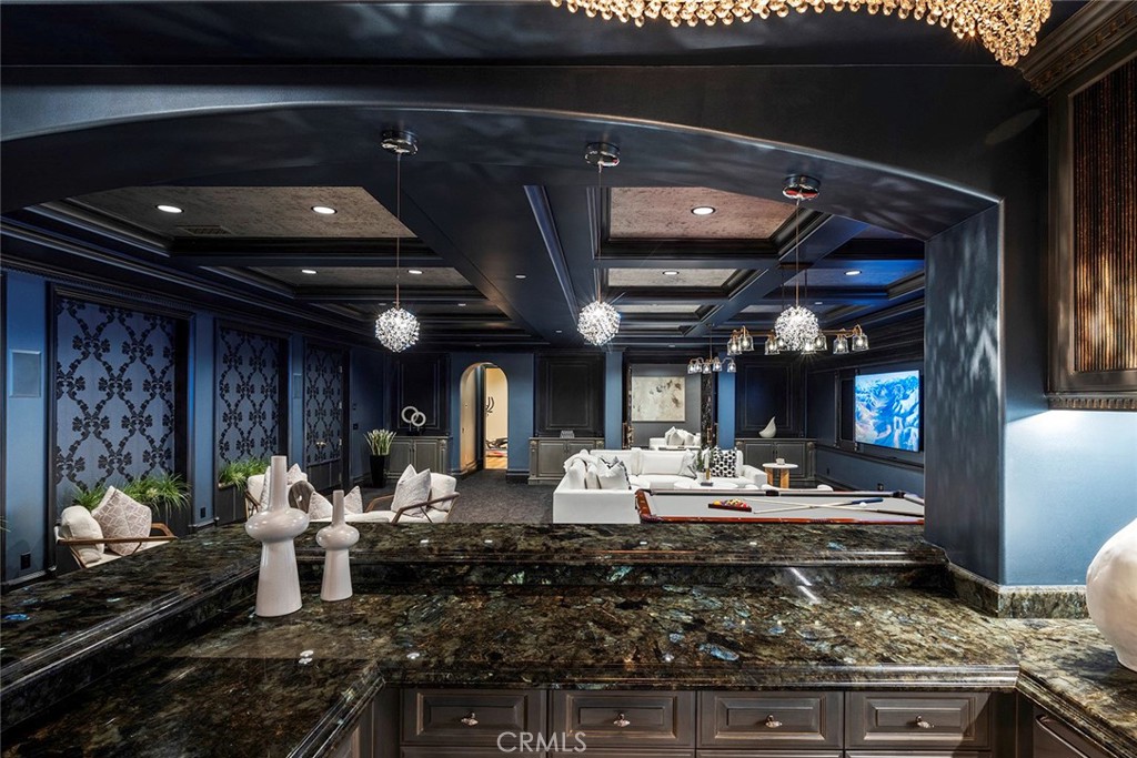 26 Deep Sea Newport Coast, CA 92657 - Photo 30 of 50 a living room with furniture and a fireplace