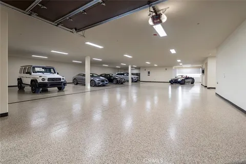 a kitchen with stainless steel appliances granite countertop a sink a stove and cabinets