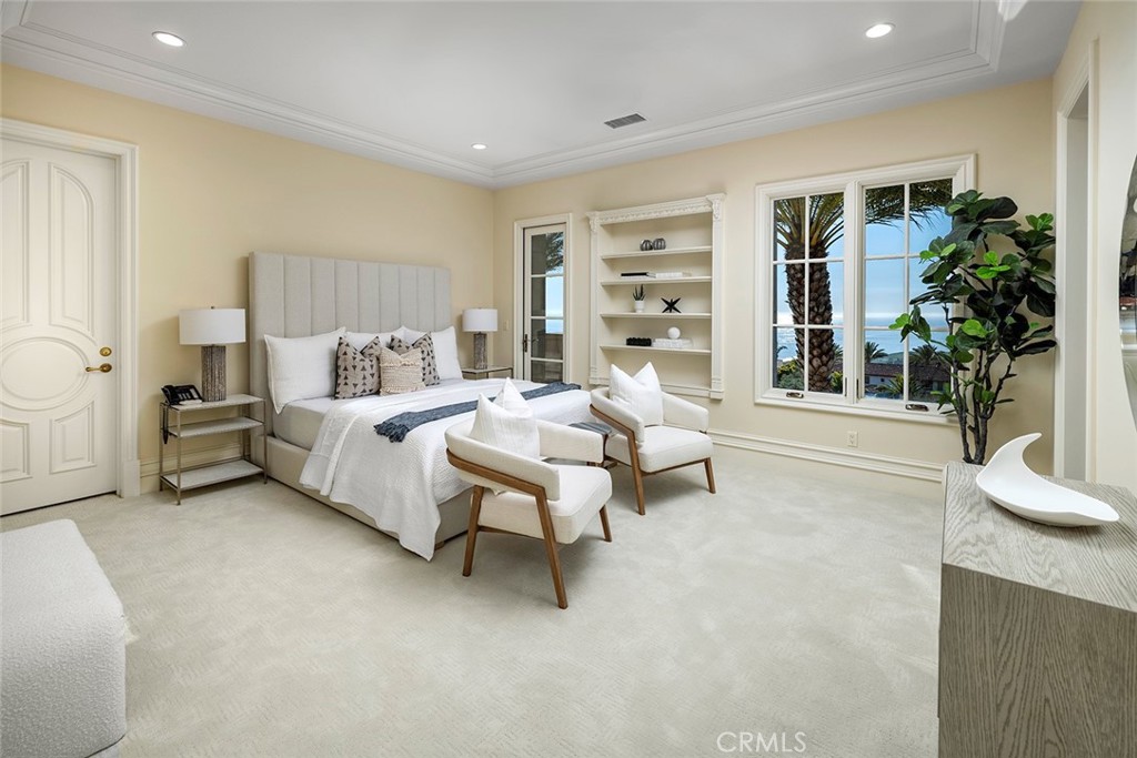 26 Deep Sea Newport Coast, CA 92657 - Photo 40 of 50 a spacious bedroom with a bed and a potted plant