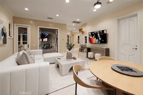a bedroom with a large bed and ceiling fan