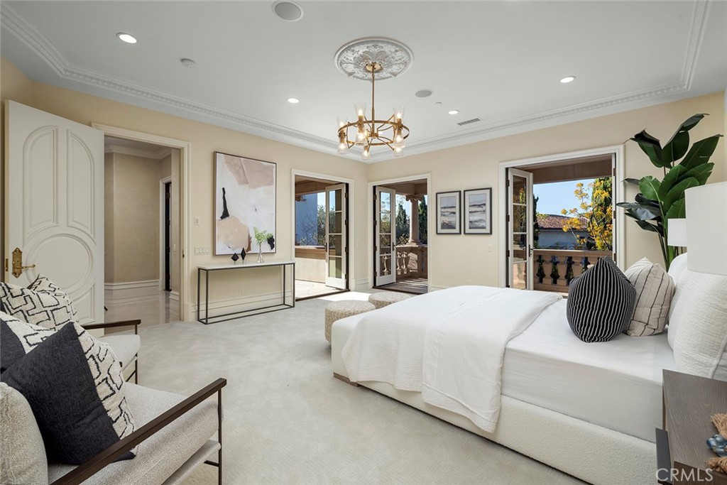 26 Deep Sea Newport Coast, CA 92657 - Photo 46 of 50 a bedroom with a large bed and ceiling fan